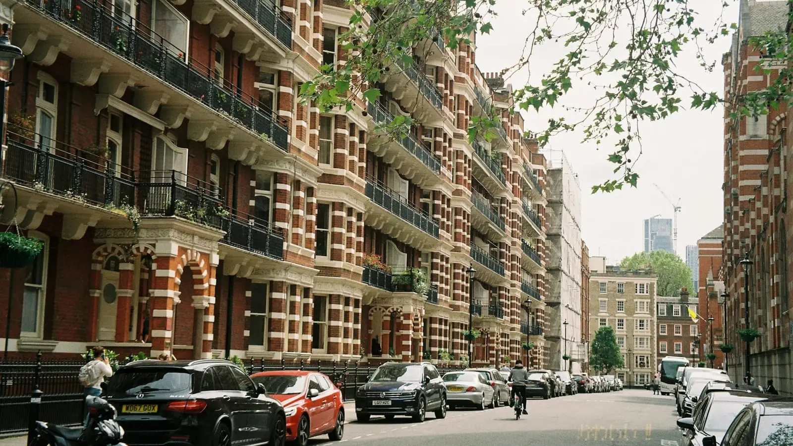 Victorian red-brick mansion blocks of flats with balconies on a Westminster street
